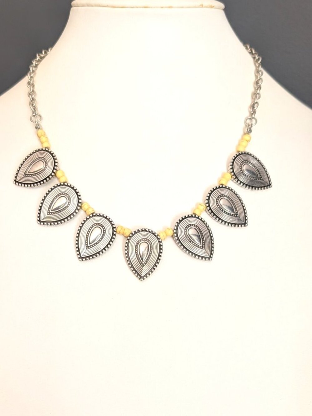 Textured silver statement necklace with yellow faux stones